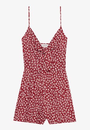 Red floral romper with thin straps, featuring a v-neckline and gathered waist. White floral print contrasts against the deep red background.