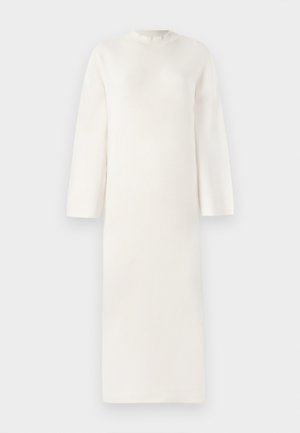 Long, pale cream dress with a round neckline and dropped shoulders. Made from a soft, textured material, it has a straight silhouette.