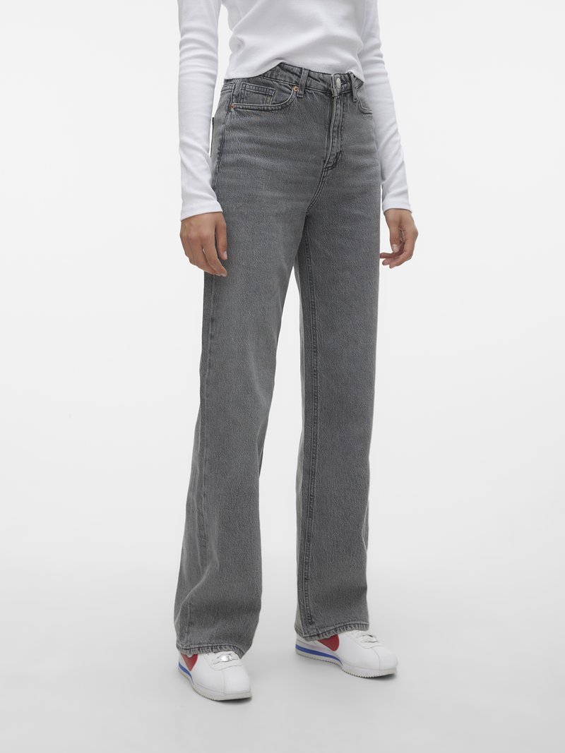 Jeans taille haute à jambe droite en denim grisé délavé. Comprend cinq poches, des coutures visibles et un élégant bouton avec fermeture éclair.