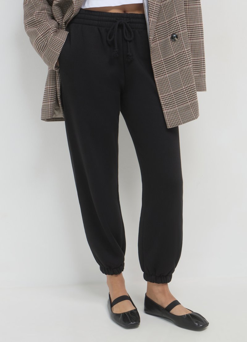 Calliope GINNICO UNITA - Pantalon de survêtement - ultrablack