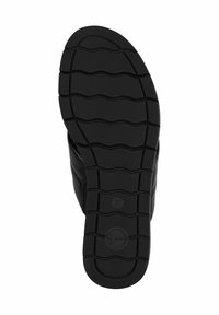 Suola di scarpa flessibile nera con texture rigata per trazione, caratterizzata da un logo circolare e dal numero di taglia 37 impresso sulla superficie.