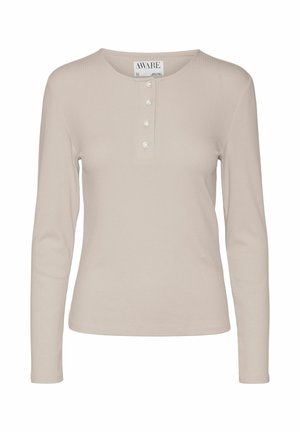Long-sleeve beige ribbed top with a round neckline, featuring three buttons and a slim fit design. Soft texture with subtle sheen.