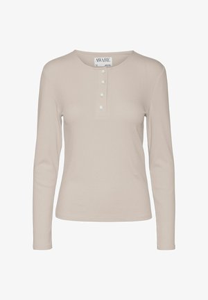 Haut en ribbed beige à manches longues avec un col rond, doté de trois boutons et d'une coupe ajustée. Texture douce avec un léger éclat.