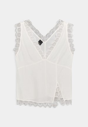 Top blanco sin mangas con escote en V, con tejido transparente y un delicado ribete de encaje con borde festoneado a lo largo del escote, las mangas y el dobladillo.