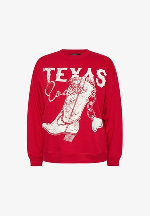 Roter Pullover mit langen Ärmeln, der ein großes weißes Grafikdesign eines Cowboy-Stiefels und das Wort "TEXAS" in fett gedruckter, abgenutzter Schrift zeigt.
