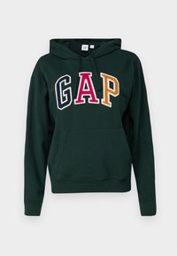 Felpa verde scuro con cappuccio, dotata di tasca a marsupio frontale, cappuccio regolabile con cordino e logo "GAP" audace e multicolore sul petto.