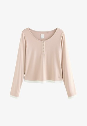 Svetlo roza dolgi rokavi s krožnim izrezom, gumbom na sprednji strani in belimi detajli na manšetah in robu. Mehka, gladka tkanina.