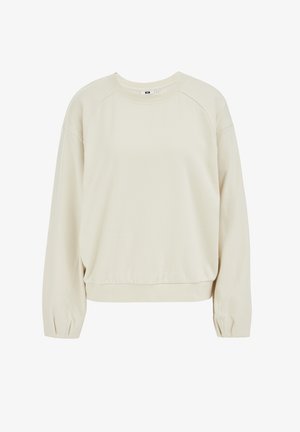 Krem pulover z okroglim izrezom, raglan rokavi in nabranim robom. Narejen iz mehkega blaga z gladko teksturo in subtilno elastiko.