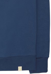 Marineblauwe sweatshirt van zacht materiaal, met ribbels aan de mouwen en een klein label met een logo aan de onderzoom.