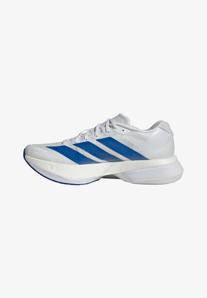 Chaussure de course blanche avec des rayures bleues, empeigne en mesh, lacets et semelle épaisse rembourrée marquée "36".