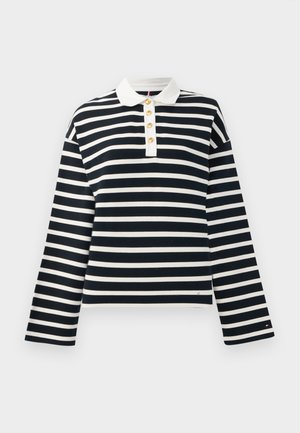 Polo de manga larga a rayas en azul marino y blanco con un collar blanco y cuatro botones dorados en la apertura. Tejido suave, corte relajado.