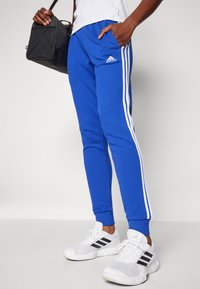 adidas Sportswear Treniņtērpa apakšdaļas - semi lucid blue