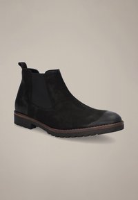 Czarne buty Chelsea z zamszu, z elastycznymi panelami bocznymi, okrągłym noskiem i gumową podeszwą z kontrastującą brązową lamówką.
