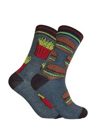 Calcetines grises con diseños estampados que presentan hamburguesas, patatas fritas y pimientos picantes. Parte superior acanalada en rojo y verde, con puntera y talón en marrón oscuro.
