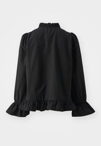 Blusa nera a maniche lunghe con polsini, orlo e colletto a balze, mostrata da dietro su uno sfondo bianco neutro.