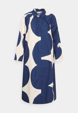 Sukienka na guziki z długim rękawem, ozdobiona dużym, granatowo-kremowym, abstrakcyjnym wzorem kwiatowym oraz spiczastym kołnierzem.