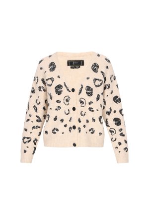 Beige kardigāns ar melnu leoparda rakstu, izgatavots no mīkstas materiāla. Tam ir V-veida kakls, garas piedurknes un melni pogu aizdari.