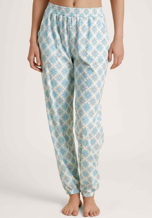Lichte, gemusterde slaapbroek in het wit, met blauwe floral ontwerpen en een elastische tailleband met taps toelopende enkels.