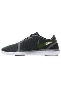 Black athletic shoes featuring a textured upper, grey accents, and a green reflective Nike logo, with a white sole labeled "LUNARLON."