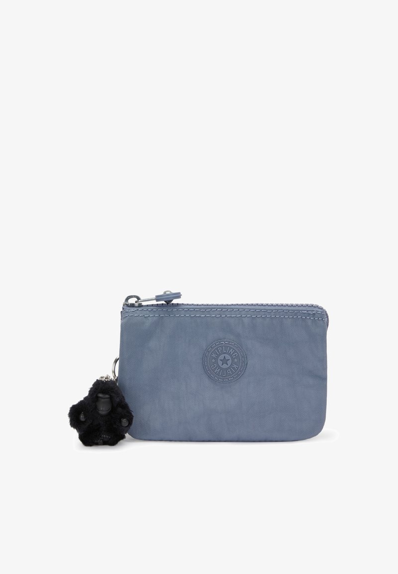 Light blue zippered pouch made of soft fabric, featuring a round logo and a black furry monkey keychain accent. Compact and rectangular shape.