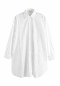 Weißes Langarmhemd mit Button-Down-Kragen. Der Baumwollstoff ist mit Lochstickerei verziert, hat einen geraden Saum und gerundete Manschettenärmel.