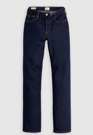 Mörkblå jeans med raka ben, orange sömmar, fem fickor och knappstängning, utlagda platt på en ljus bakgrund.