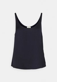 Beżowa bluzka bez rękawów, z okrągłym dekoltem, z miękkiego materiału, lekkiej konstrukcji i luźnym kroju. Metka widoczna przy dekolcie.