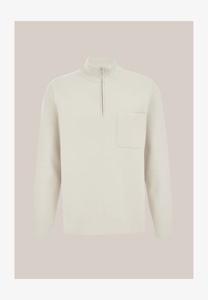 Svetarnik kremne barve z dolgimi rokavi in pol-zipo ovratnikom ter enim žepom na prsih, prikazan na nevtralni podlagi.