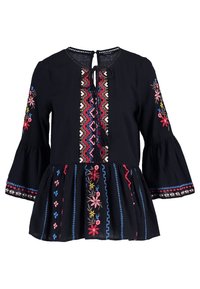Blusa nera ricamata con maniche a campana lunghe, caratterizzata da motivi floreali colorati e una chiusura a occhio di bue con un dettaglio a fiocco.