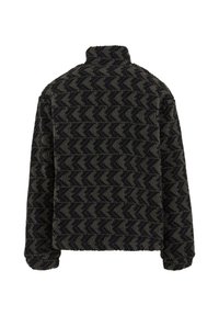 Giacca pullover nera e verde oliva con colletto alto. Il tessuto texture presenta un motivo a zigzag. Maniche lunghe, senza chiusure.
