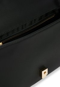 Tommy Hilfiger MONOGRAM QUILTED - Cross body bag - black