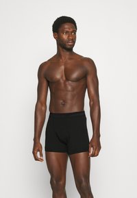 Calvin Klein Underwear TRUNK 3 PACK COTTON STRETCH - Cuecas boxer - black