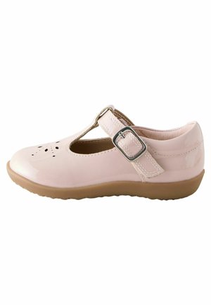 Light pink patent leather Mary Jane shoe with perforated toe design, adjustable buckle strap, and brown rubber sole.