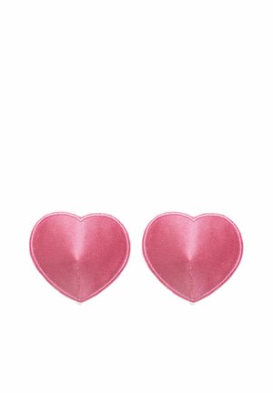 Pastylki silikonowe w kształcie serca, o błyszczącym różowym wykończeniu, cechujące się gładką fakturą z subtelnym szwem wzdłuż krawędzi zapewniającym pewne dopasowanie.