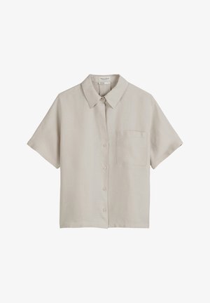 Korte mouw overhemd met knopen in lichtbeige linnen, voorzien van een puntige kraag en een enkele borstzak. Soepele textuur, minimalistisch ontwerp.