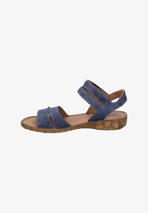 Sandale bleue en cuir avec deux larges sangles, orteils ouverts et support arrière. Semelle en caoutchouc texturé beige clair avec un motif floral.