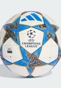 Champions League soccer ball featuring a white base, blue and gold accents, star-shaped panels, and intricate designs with equine motifs.
