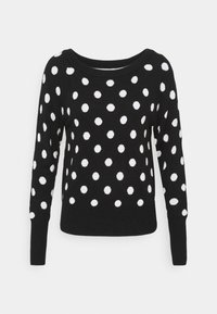 Black sweater with white polka dots, round neckline, long sleeves, and ribbed cuffs and hem. Soft knit texture throughout.