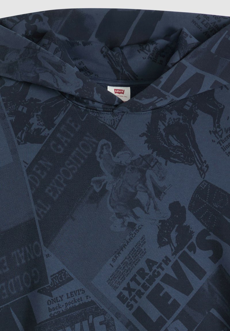 Dark blue Levi's hoodie with printed vintage-style text and images, including a rider on horseback and various promotional phrases.