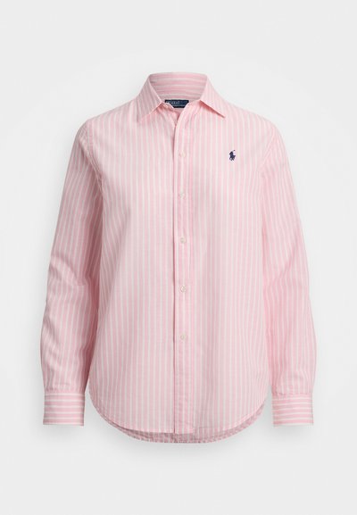 Gaiši rozā svītrains krekls ar garām piedurknēm, klasiskās apkakles un izšūtu logo kreisajā krūtīs. Mīksta kokvilnas audums.