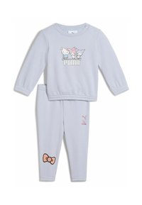 Jasnoniebieska bluz sweatshirt z długimi rękawami i grafiką Hello Kitty; dopasowane jasnoniebieskie legginsy z różowym detalem w postaci kokardki i logo.