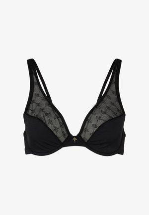 Soutien-gorge noir avec des panneaux latéraux en dentelle transparente, des bonnets triangulaires, des bretelles ajustables et un petit accent métallique au centre devant.