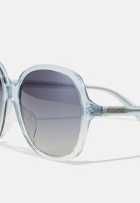 COACH Solbriller - transparent blue gradient