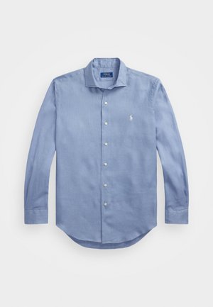 Light blue long-sleeve button-up shirt made of woven fabric, featuring a pointed collar, seven buttons, and a small logo on the chest.