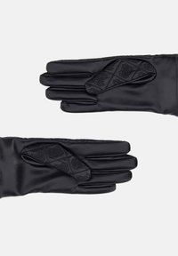 Black leather gloves with quilted patterned patches on thumbs, displayed flat on a white background, showing front and back sides.