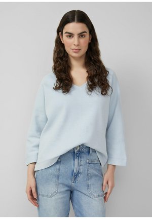 - Bluzka z długim rękawem