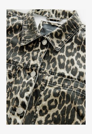 Leopard print denim jacket featuring silver snap buttons, a pointed collar, and front pockets. The fabric has a textured finish.