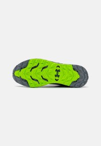 Talpa de pantof cu o bază de cauciuc verde strălucitor, având un model texturat în formă de triunghi, accentuată cu detalii gri și negre.