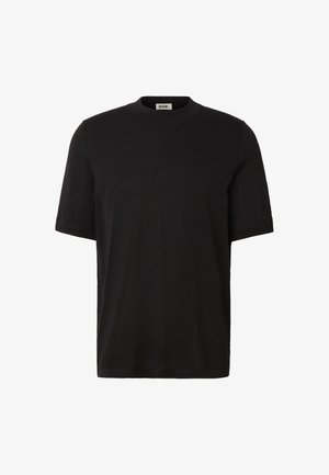 T-shirt nera a maniche corte con scollo tondo e una piccola etichetta bianca nella parte posteriore del colletto interno.