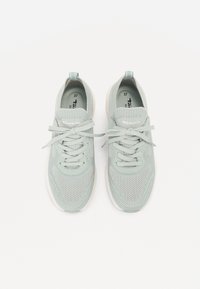 Light gray lace-up sneakers with mesh and fabric details, loop tabs on heels, and white soles, shown from above on a white background.